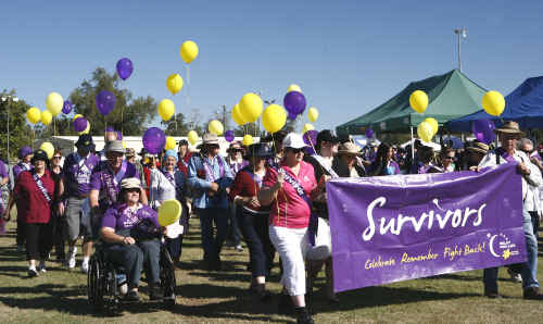 Survivors and their carers started Relay for Life by walking the first lap. Survivors and their carers started Relay for Life by walking the first lap.